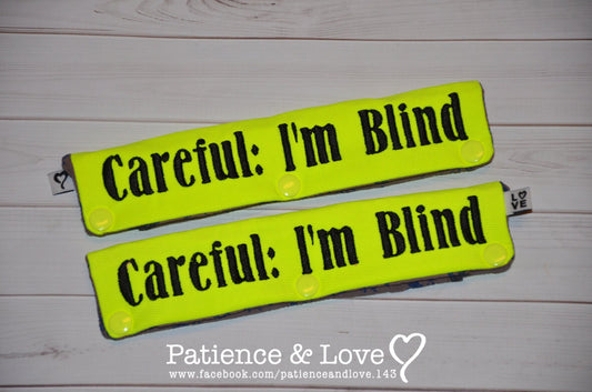  One Leash Sleeve embroidered with the following on both sides of the sleeve:       Careful I'm Blind      Example in the listing photo has the following color selections:        • Bright yellow fabric, Black (1800) text.