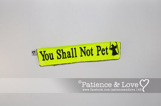 One Leash Sleeve embroidered with the following on both sides of the sleeve:       You Shall Not Pet with wizard      Example in the listing photo has the following color selections:        • Bright yellow fabric, Black (1800) text.  • Be sure to Specify the thread color you would